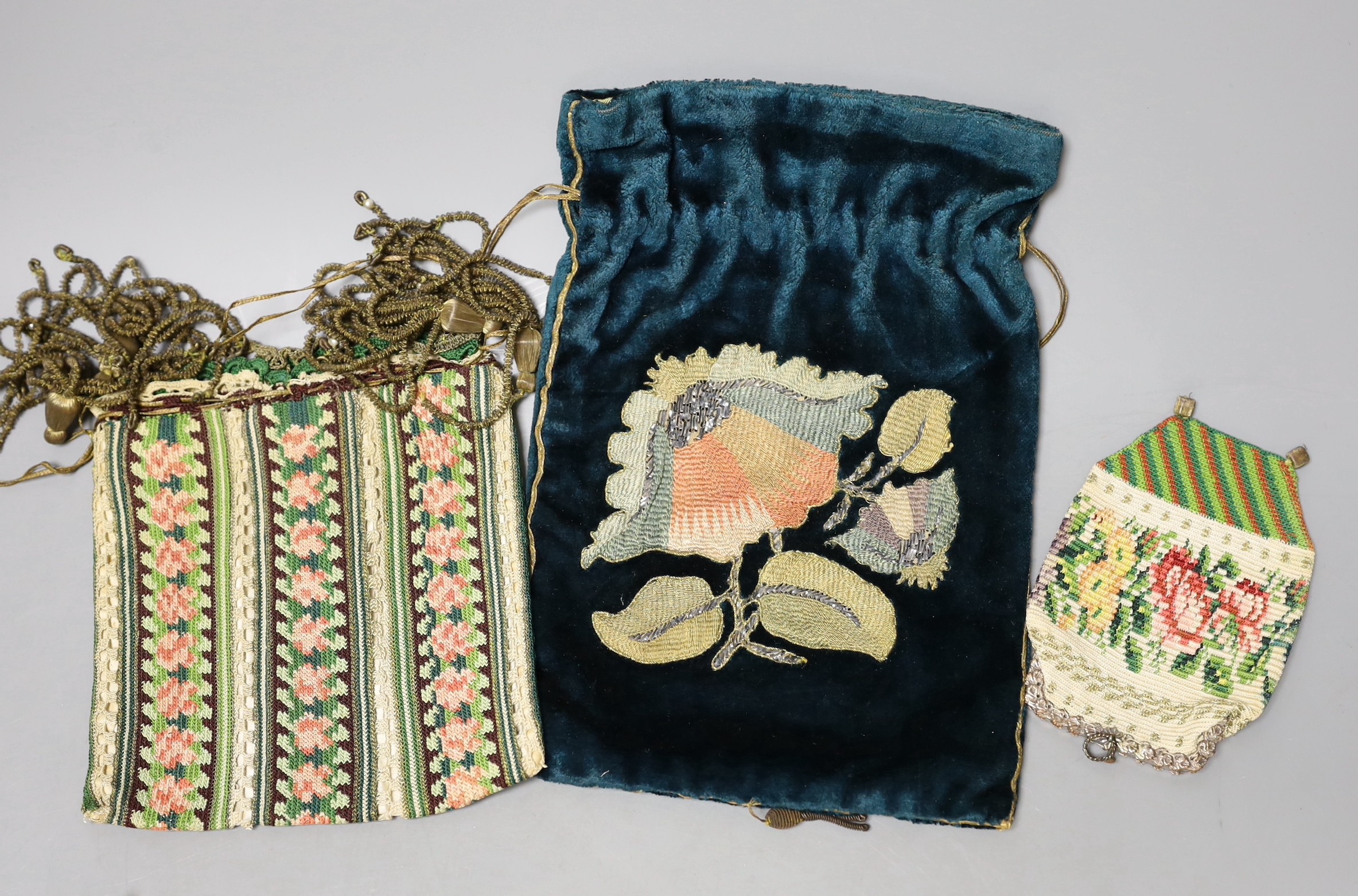 A late 19th century embroidered bible bag another smaller finely knitted bible bag, eight hand worked purses, a floral knitted purse, three misers purses and a novelty “jug” shaped purse,(15)